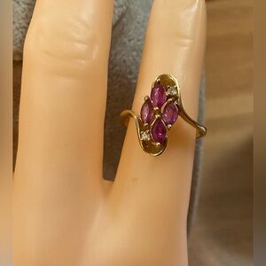 14k. Pure Yellow gold ring with 4 oval rubies and 2 accents diamonds size seven.